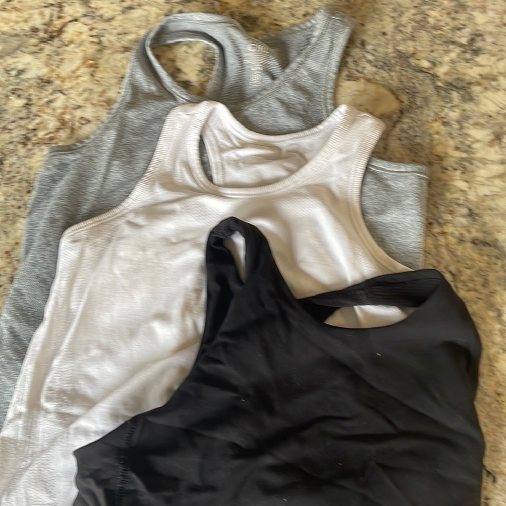 Three Athleta tanks sizes 12 and 14